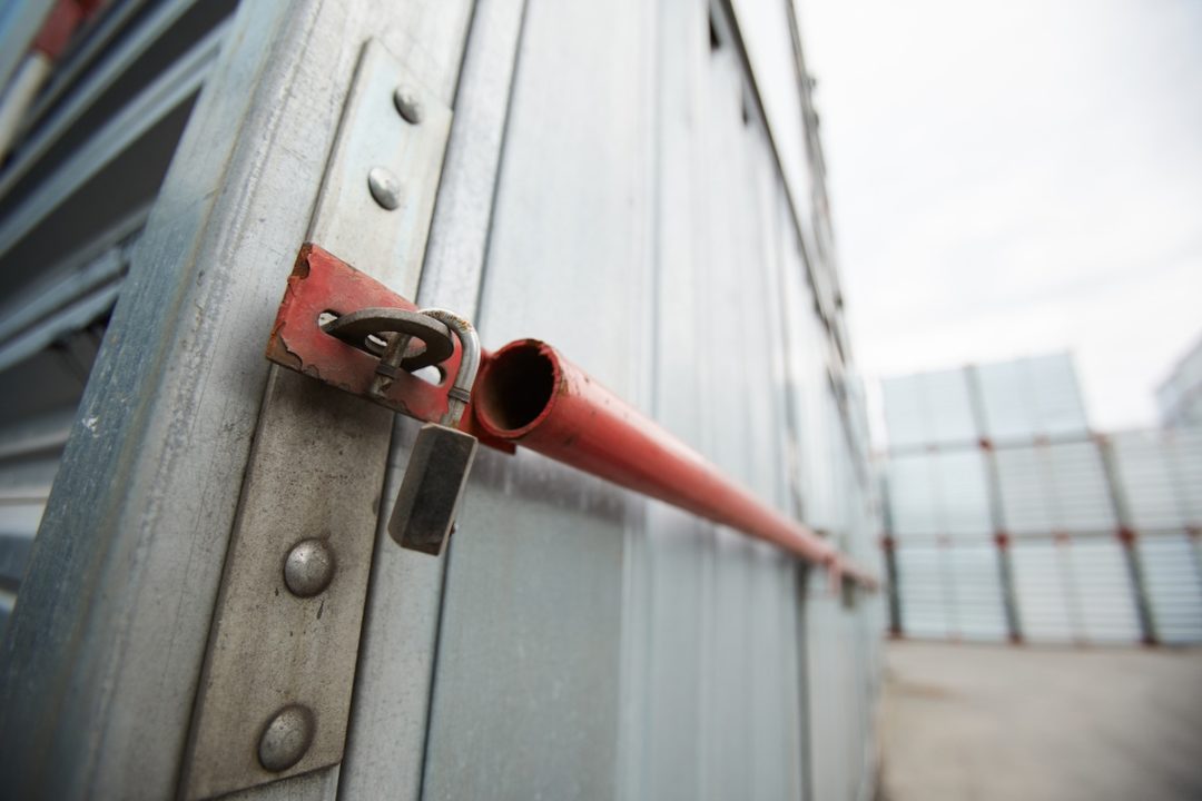 A broken lock on a cargo container